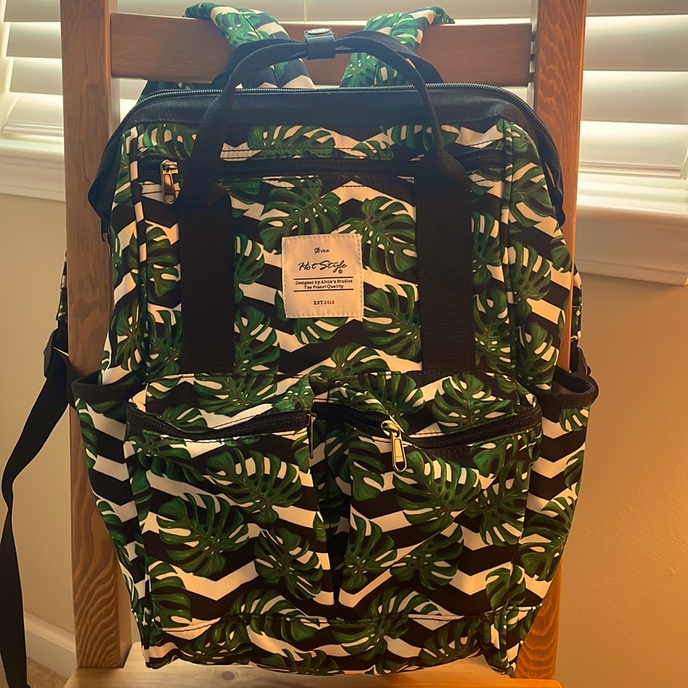 Backpack, laptop safe with top load and straps for hand carry.